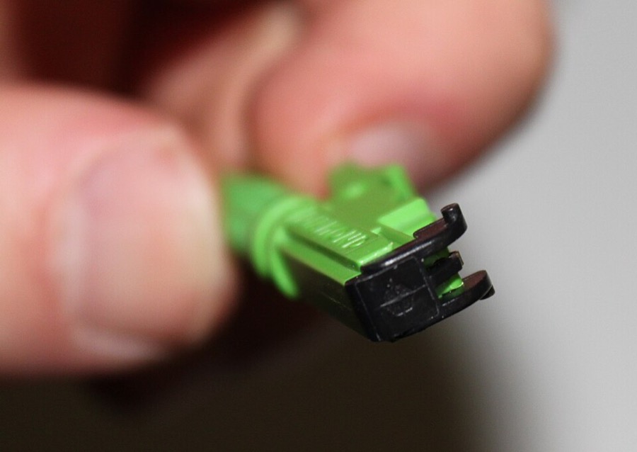 E-2000 fiber optic connector with a dust flap